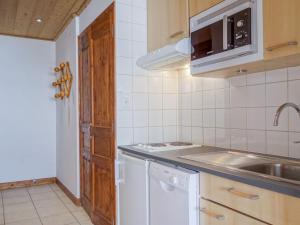 a kitchen with a sink and a stove top oven at Apartment La Grande Casse - Lavachet-3 by Interhome in Tignes