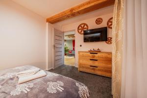 Posteľ alebo postele v izbe v ubytovaní Apartament Podwika