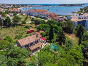 an aerial view of a house with trees and the water at Holiday Home Villa Crispo - MDN119 by Interhome in Medulin