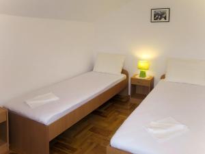 Posteľ alebo postele v izbe v ubytovaní Apartment Ananina by Interhome