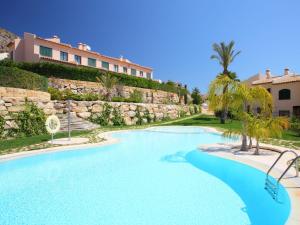 a swimming pool in front of a resort at Holiday Home Mirador II by Interhome in Cala de Finestrat