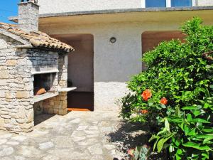 a stone oven in front of a house at Holiday Home Franko 1 - MDN182 by Interhome in Ližnjan