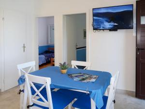 a blue table and chairs in a room at Holiday Home Neli - ISO305 by Interhome in Rogač