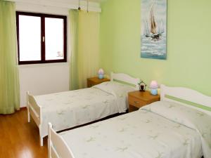Posteľ alebo postele v izbe v ubytovaní Apartment Borovina-2 by Interhome + 12 fotografií