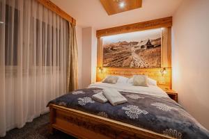Posteľ alebo postele v izbe v ubytovaní Apartament Podwika