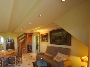 a living room with a couch and a table at Apartment Sonnenkliff-3 by Interhome in Groß Zicker +31 photos