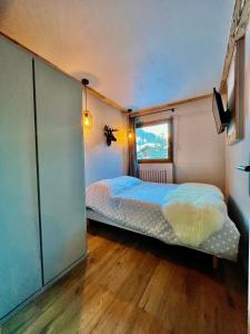 Postel nebo postele na pokoji v ubytování Grey Suite Val d'Isère