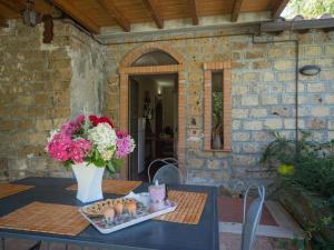 a table with a vase of flowers and eggs on it at Apartment Casa Domenico n- 1 by Interhome in Montefiascone +31 photos