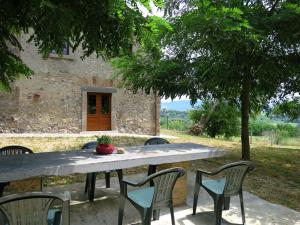 a table and chairs sitting in front of a building at Holiday Home Pasqualino by Interhome in Bagnoregio