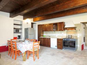 a kitchen with a table and chairs in a kitchen at Holiday Home Pasqualino by Interhome in Bagnoregio