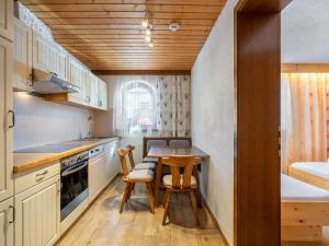a small kitchen with a table and chairs at Apartment Nadine-8 by Interhome in Sölden +25 photos