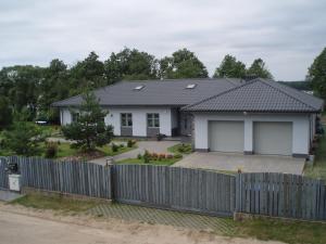 a house with a fence in front of it at Apartment Głęboczek 21 by Interhome in Głęboczek