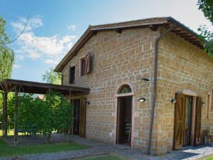 a brick building with a door and a tree at Apartment Casa Ricardo n- 4 by Interhome in Montefiascone +29 photos