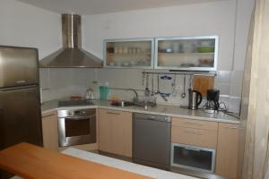 Η κουζίνα ή μικρή κουζίνα στο Apartments Kligge