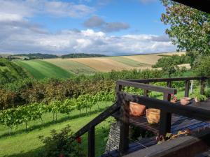 a view of the rolling fields from the porch of a house at Holiday Home Moja Mała Toskania by Interhome in Cisowa