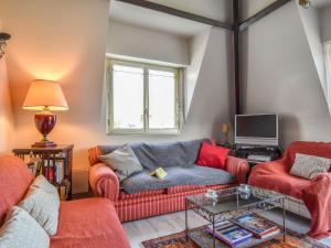 a living room with a couch and two chairs at Apartment Marie Antoinette-2 by Interhome in Deauville