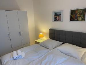 a bedroom with a bed with towels on it at Apartment Seebär by Interhome in Norddeich