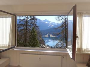 a window with a view of a mountain at Apartment Chesa Cripels I by Interhome in St. Moritz