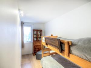 a bedroom with a bunk bed and a window at Apartment Les Marinas-3 by Interhome in Deauville +14 photos