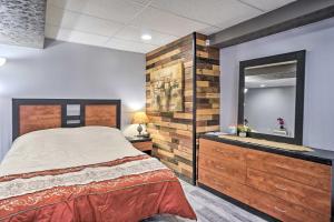 a bedroom with a large bed and a mirror at Zen Studio about 20 Min to Downtown Columbus! in Blacklick