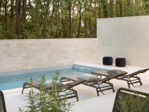 Bazén v ubytování Holiday Home Oliva 2 by Interhome nebo v jeho okolí + 28 fotografií