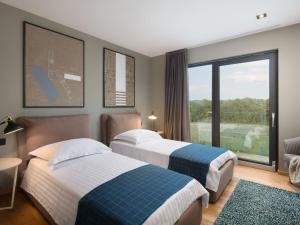 Postel nebo postele na pokoji v ubytování Holiday Home Oliva 2 by Interhome