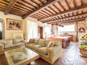 a living room with couches and a pool table at Villa Vista da Rocca di Papa-1 by Interhome in Rocca di Papa