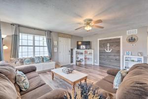 a living room with a couch and a table at Family-Friendly South Padre Island Escape with Grill in South Padre Island