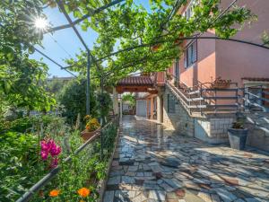 a stone walkway in front of a house at Apartment Bumbak by Interhome in Umag