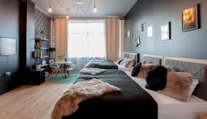 a bedroom with two beds and a table in it at P182 Hidden Hostel in Berlin