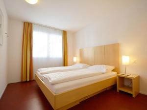 Ένα ή περισσότερα κρεβάτια σε δωμάτιο στο Apartment Surses Alpin-1 by Interhome