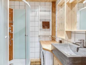 a bathroom with a sink and a shower at Studio Le Curling A - Val Claret-21 by Interhome in Tignes