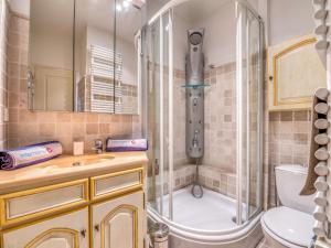 a bathroom with a shower and a toilet and a sink at Apartment Boulevard Louis Blanc-1 by Interhome in Saint-Tropez