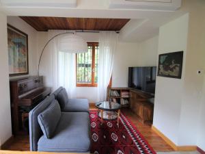 A television and/or entertainment centre at Holiday Home Gemma by Interhome