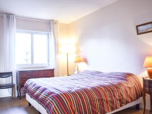 En eller flere senge i et værelse på Apartment Les Terrasses de Tourgeville-3 by Interhome