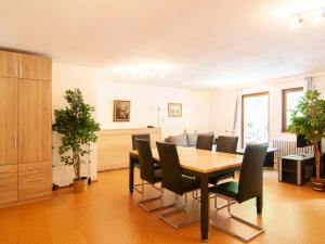 a dining room with a table and chairs at Apartment Haus Wildstein-2 by Interhome in Kautenbach