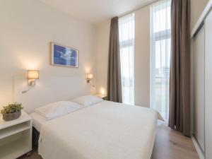 Postel nebo postele na pokoji v ubytování Holiday Home Water Resort Oosterschelde - huisnr- 93 by Interhome