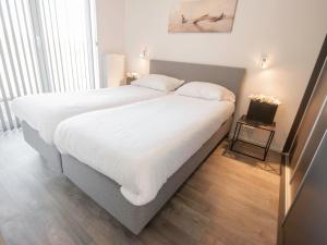 Postel nebo postele na pokoji v ubytování Holiday Home Vakantiehuis Ruisweg 85 by Interhome