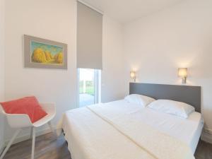 Postel nebo postele na pokoji v ubytování Holiday Home Vakantiehuis Ruisweg 101 by Interhome