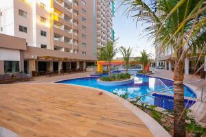 a swimming pool in the middle of a building at Enjoy Olimpia Park Resort in Olímpia