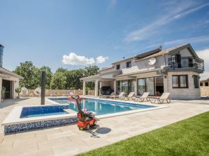 a moped parked in front of a house with a swimming pool at Villa Oasis of peace by Interhome in Gornji Proložac +50 photos
