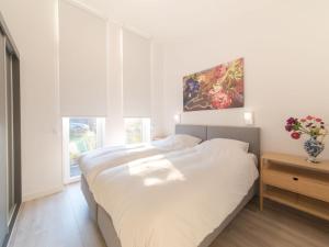 Postel nebo postele na pokoji v ubytování Holiday Home Vakantiehuis Ruisweg 73 by Interhome