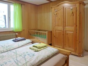 A bed or beds in a room at Apartment Chalet im Gässli by Interhome