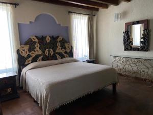 Postel nebo postele na pokoji v ubytování Casa Árbol Hotel