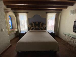Postel nebo postele na pokoji v ubytování Casa Árbol Hotel