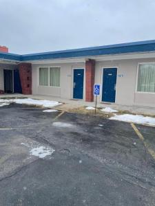 an empty parking lot in front of a building at American Motor Inn - Rock Island in Rock Island