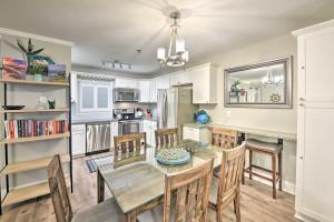 a kitchen and dining room with a table and chairs at Walkable Hilton Head Island Condo with Resort Perks in Hilton Head Island