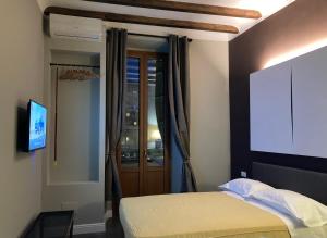 Posteľ alebo postele v izbe v ubytovaní Hotel Calypso