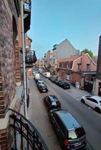 a street with cars parked on the side of the road at Modern duplex 100m2 perfect to visit Brussels in Brussels