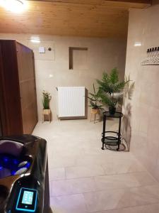 a hallway with a room with plants in it at Cserh&aacute;tv&ouml;lgy Panzi&oacute; in Als&oacute;told